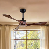 Ceiling fan with wooden blades in a room with a window showing trees outside