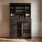 Wine cabinet with wine bottles, glasses, and decanter against a beige wall.