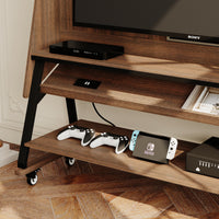Brown TV stand with open shelves, black metal frame, and caster wheels