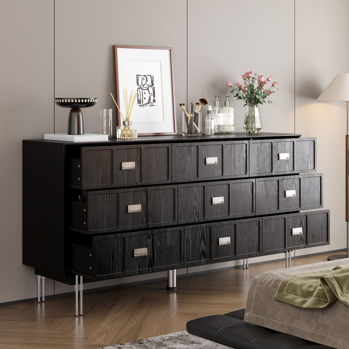 Modern black dresser with silver handles and metal legs