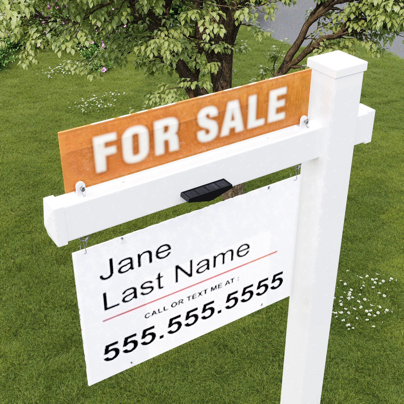 Real estate sign with contact information on a grassy lawn.