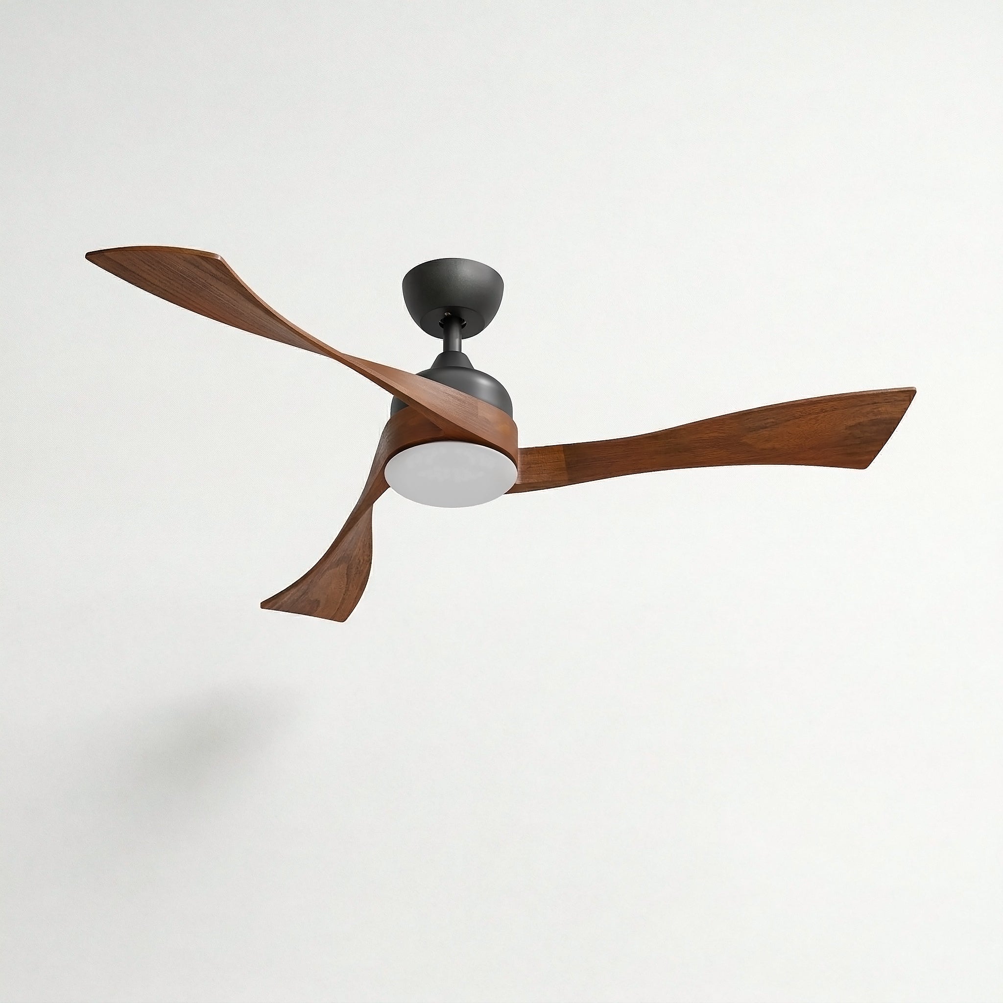 Ceiling fan with wooden blades and a black light fixture on a white background