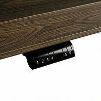 Dark wood standing desk with electric height adjustment and control panel