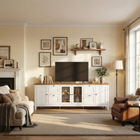 White TV stand with wood top, glass cabinet doors, drawers, and adjustable storage shelves