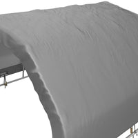 Gray fitted sheet on a bed with a white background