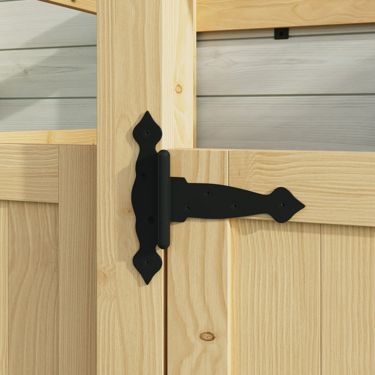 Black metal hinge on a wooden door