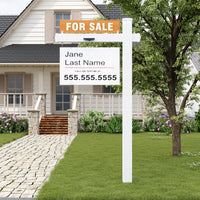 Real estate sign in front of a house