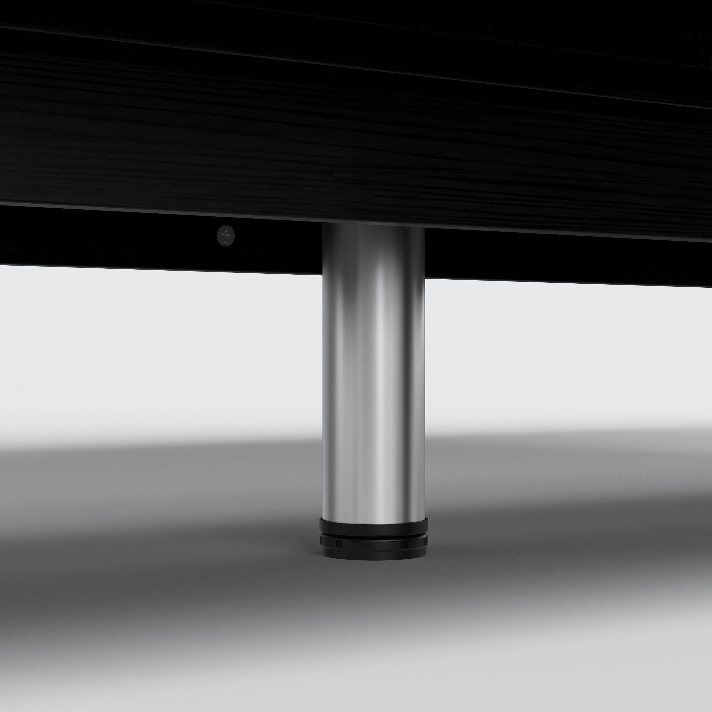 Modern black dresser with silver handles and metal legs
