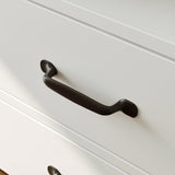 Black cabinet handle on a white drawer
