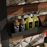 Four bottles of S1 coffee syrup on a shelf with a stone wall background