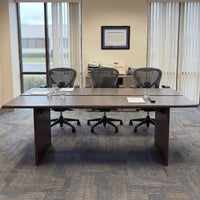 Brown wood writing desk with cable management