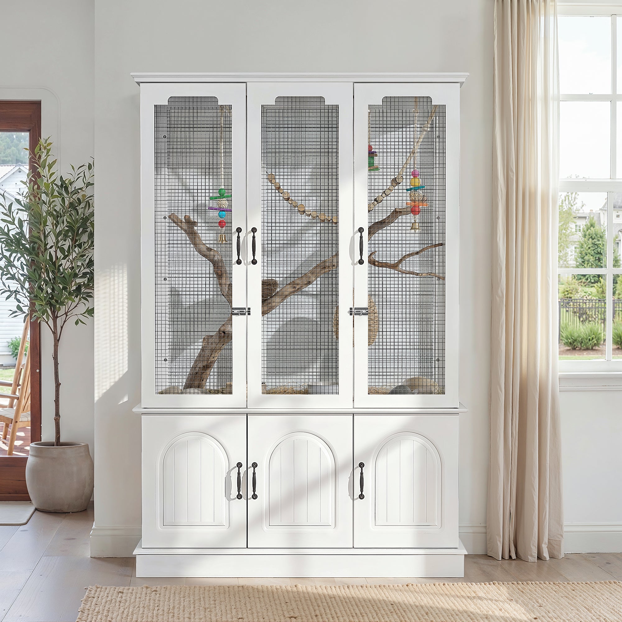 White cabinet with glass doors in a room with a plant and window.