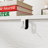 White 3-drawer nightstand with raised panel fronts and black handles
