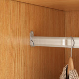 Metal rod with hooks attached to a wooden cabinet