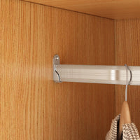 Metal rod with hooks attached to a wooden cabinet