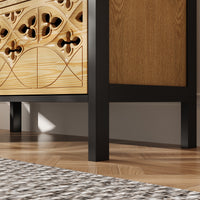 Wooden cabinet with decorative carvings on a wooden floor.