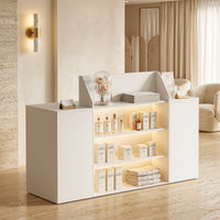 White reception desk with open display shelves and built-in LED lighting