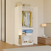 White armoire with mirrored doors and cabinet storage