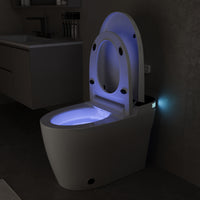 White smart toilet with open lid, built-in bidet, and ambient night light
