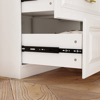 White wardrobe with gold handles in a modern bedroom setting