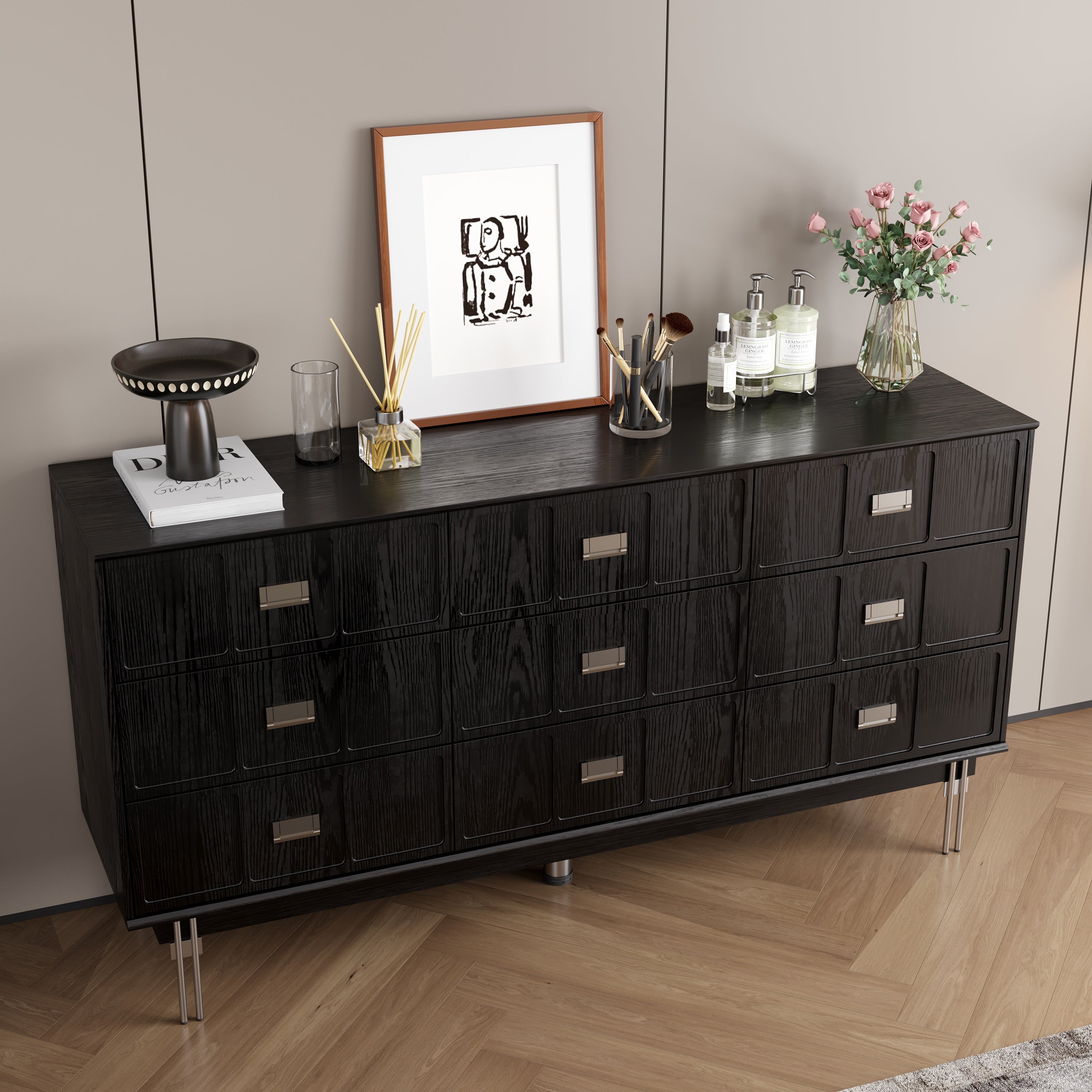 Modern black dresser with silver handles and metal legs