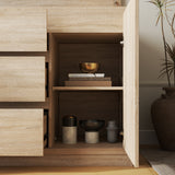 Wooden cabinet with open doors displaying decorative items in a room setting