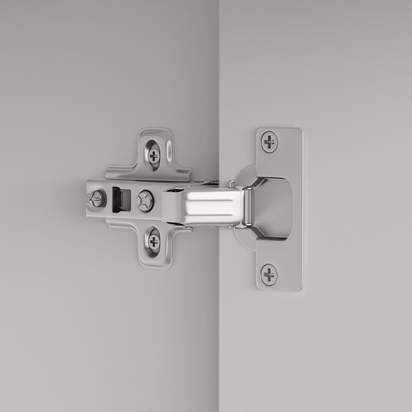 Close-up of a chrome door hinge on a gray background