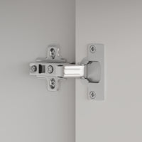 Close-up of a chrome door hinge on a gray background