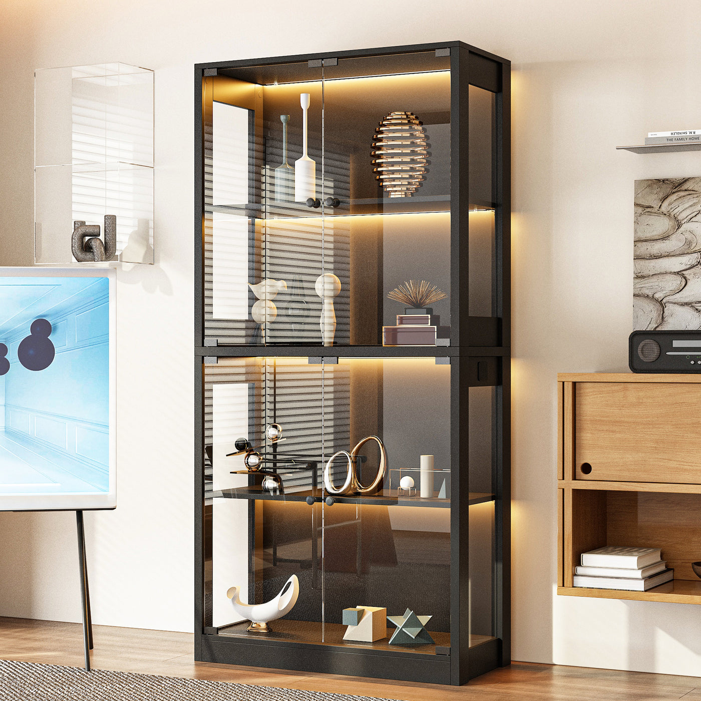 Modern black glass display cabinet with interior lighting in a room setting.