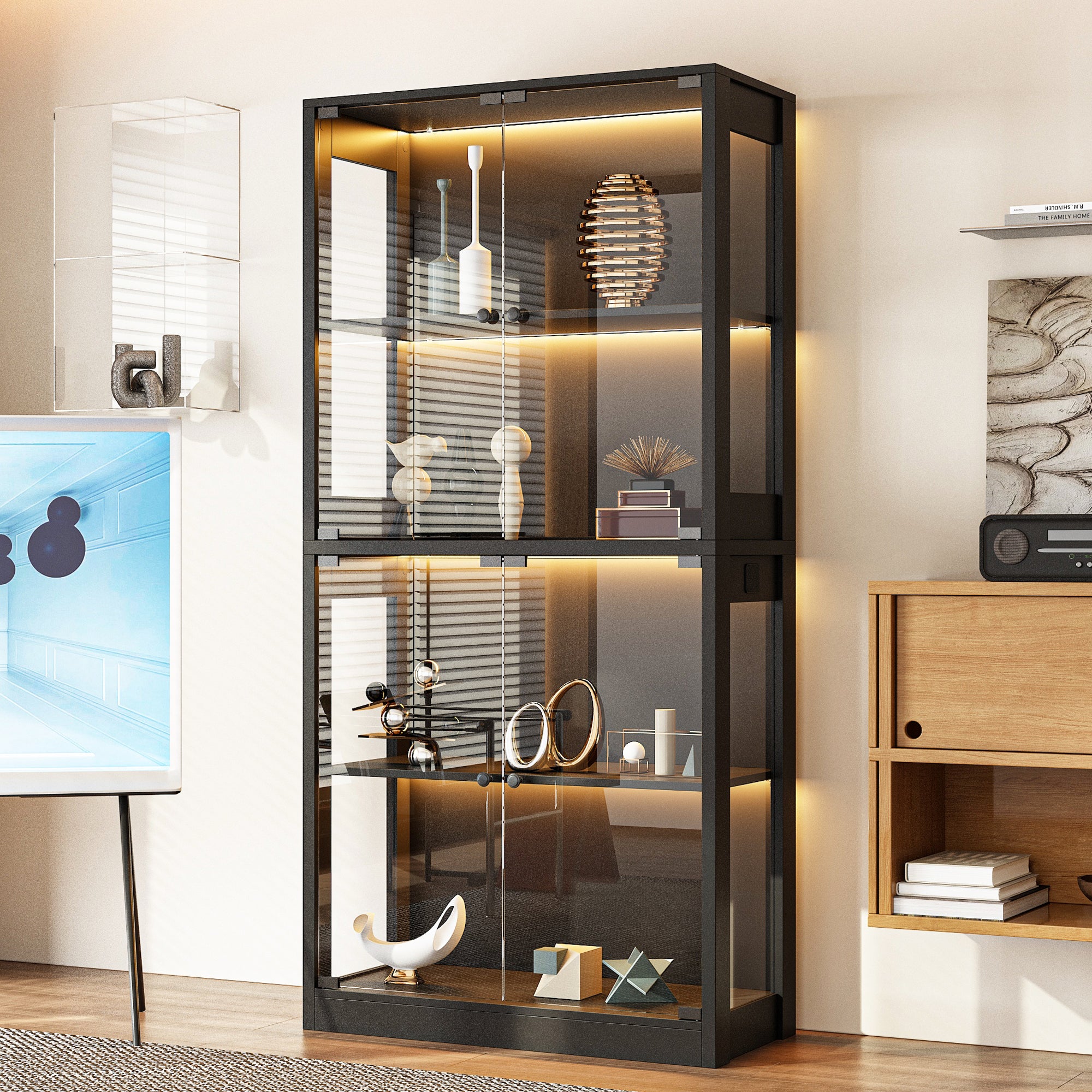 Modern black glass display cabinet with interior lighting in a room setting.