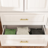 White wardrobe with gold handles in a modern bedroom setting