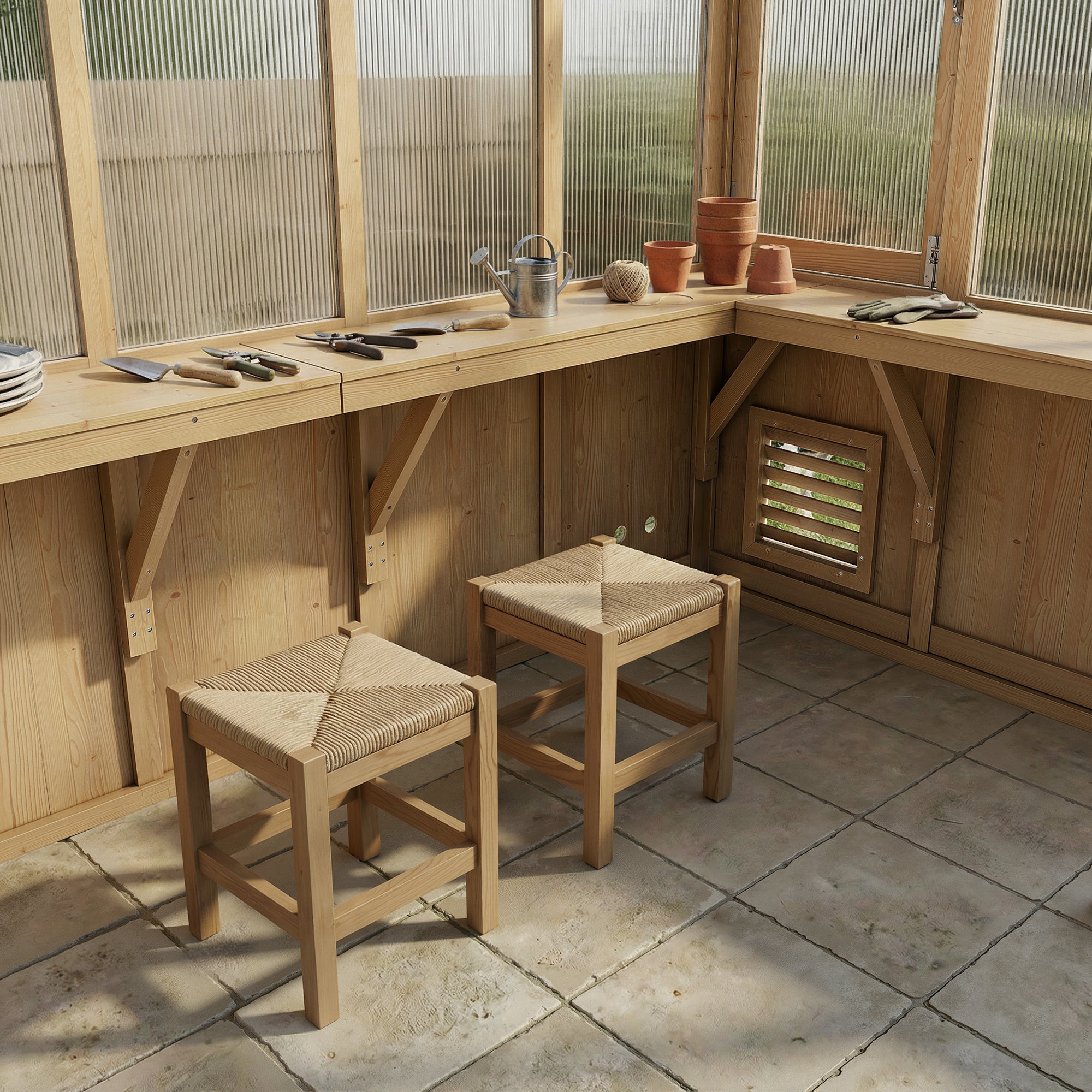 Wooden workbench with stools in a greenhouse setting