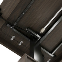 Dark wood standing desk with electric height adjustment and control panel