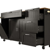 Black kitchen island with wood top, drawers, cabinet doors, towel bar, and wheels