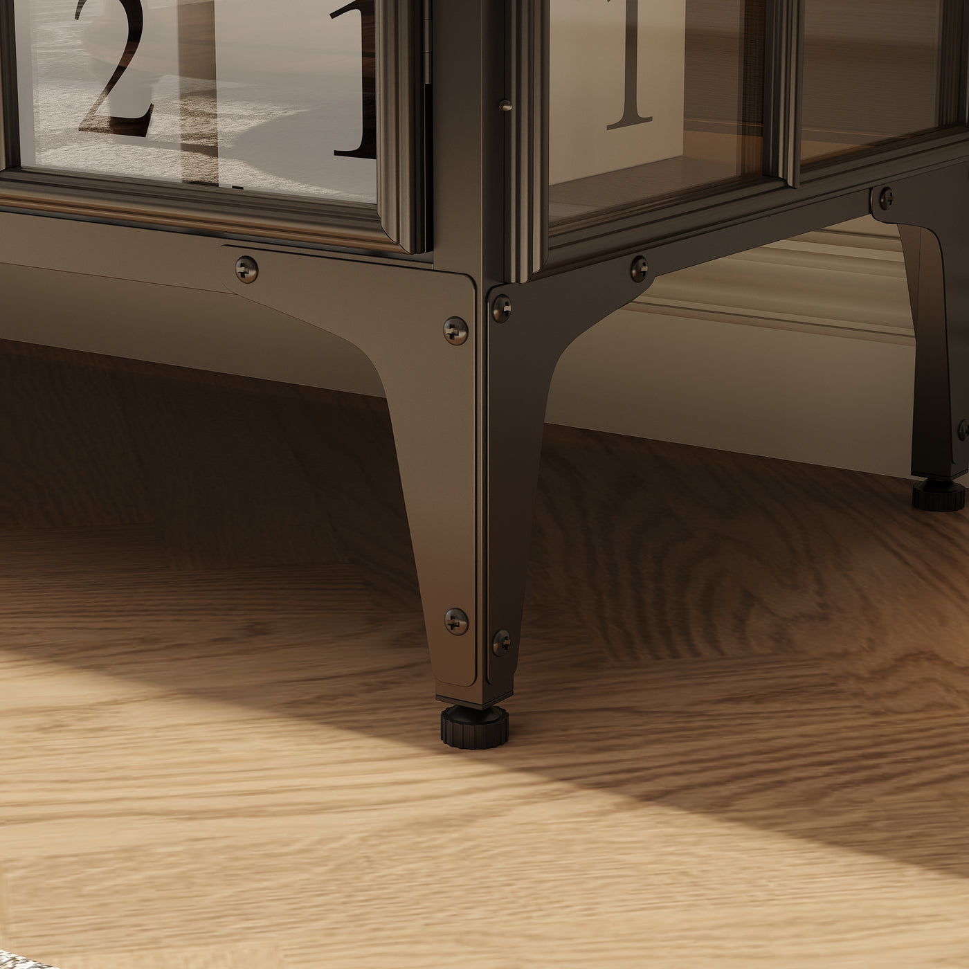 Close-up of a decorative table with glass panels on a wooden floor.