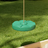 Green swing seat hanging on a chain against a grassy background