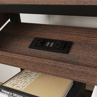Brown TV stand with open shelves, black metal frame, and caster wheels