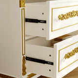 White cabinet with gold accents and open drawers on a neutral background