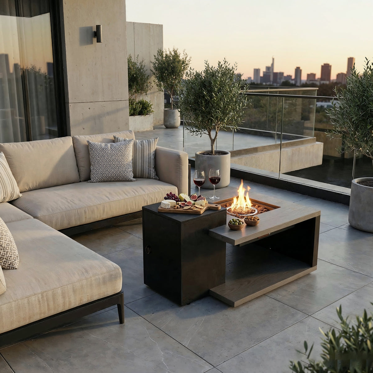 Outdoor patio with sectional sofa, fire pit table, and city skyline view.
