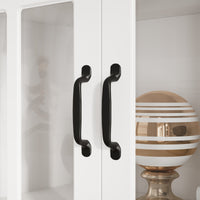 White bookcase set with glass doors, lower cabinets, and center open shelves