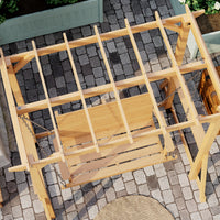 Wooden swing on a stone patio