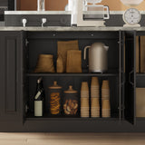 Open black cabinet with kitchen items including a kettle, cups, and decorative jars.