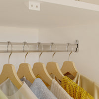 White armoire with mirrored doors and cabinet storage