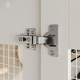 Close-up of a chrome door hinge on a white door with tiled wall background