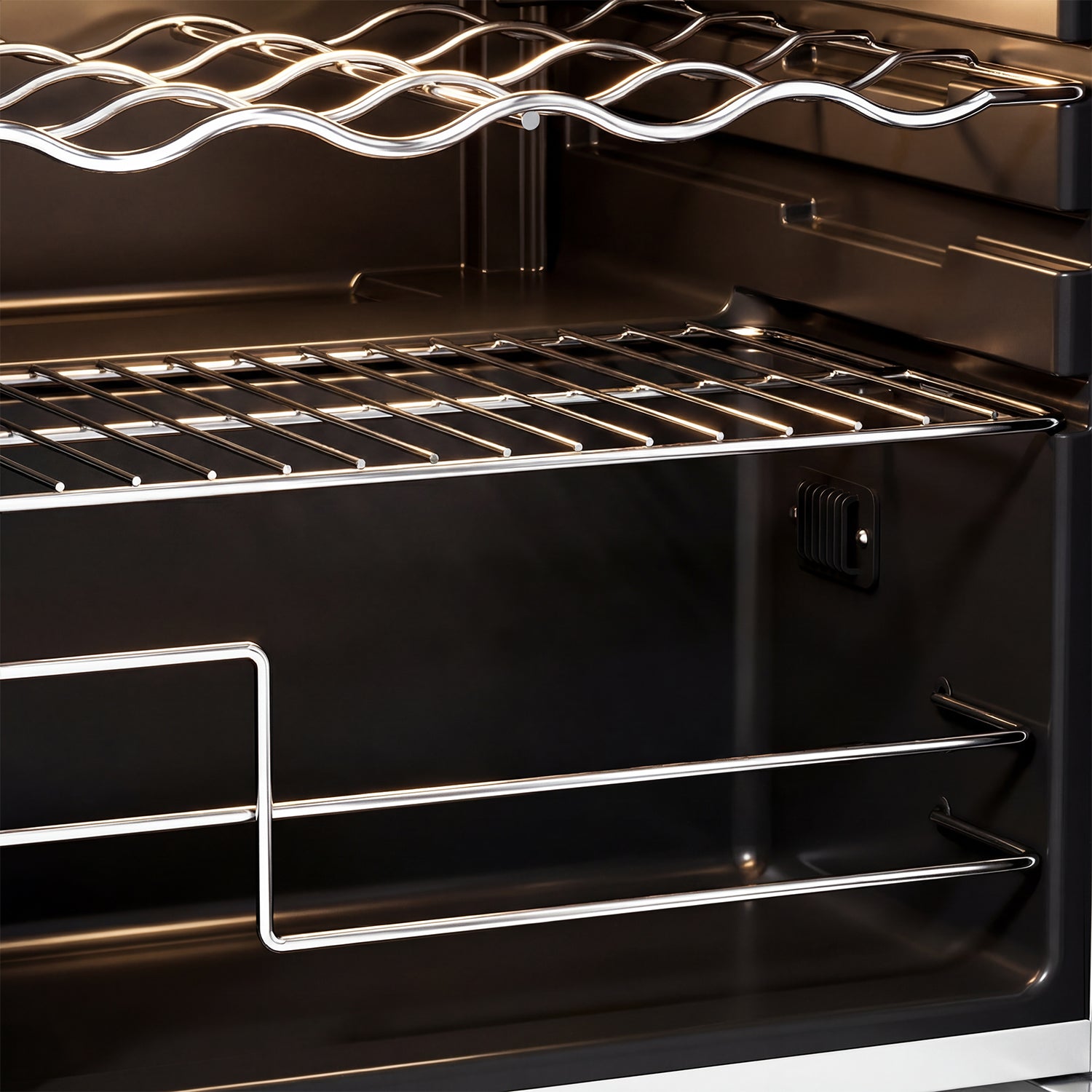 Close-up of a black oven interior with metal racks