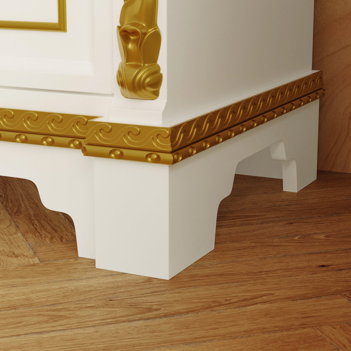 Decorative white and gold architectural element on a wooden floor