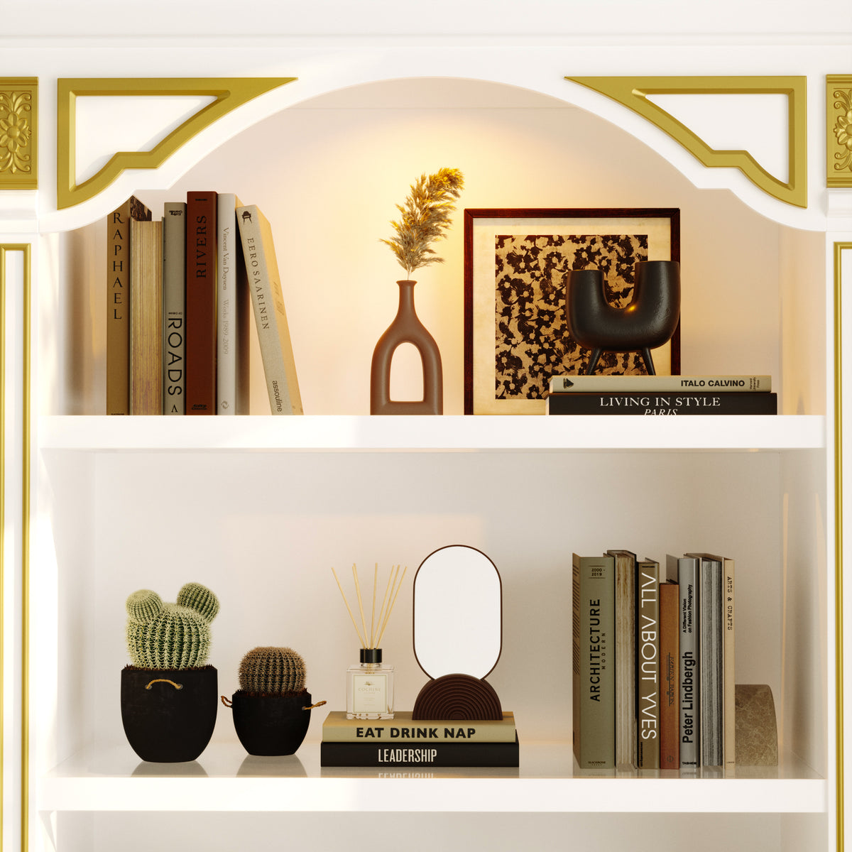 Decorative bookshelf with books, a cactus, and a lamp in a stylish interior setting.