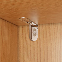Metal cabinet hinge on a wooden surface