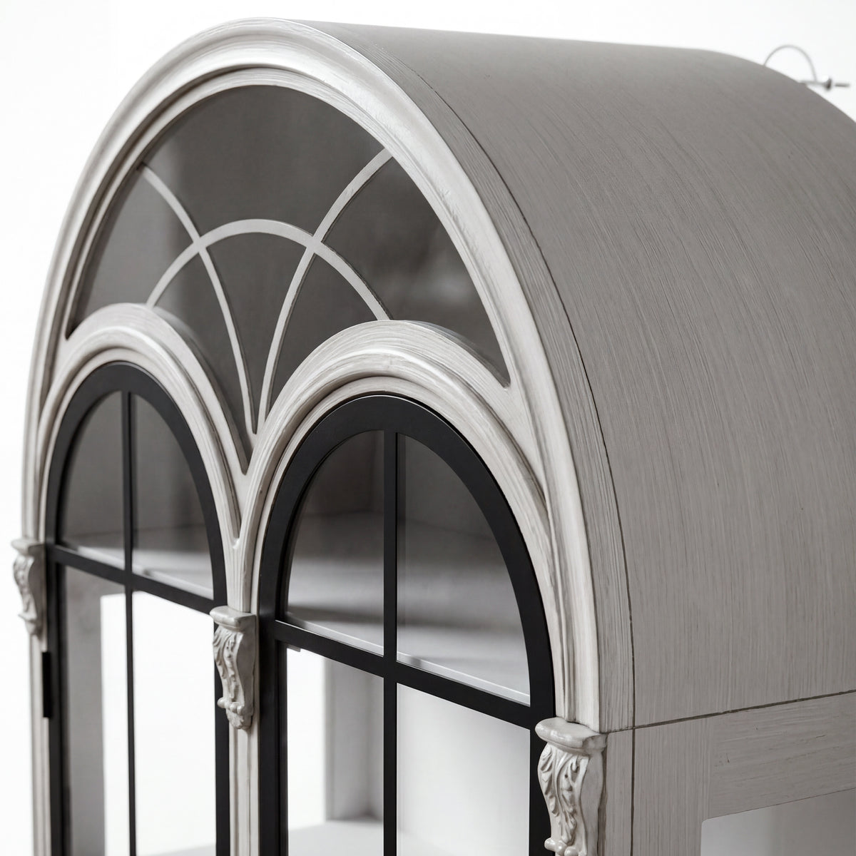 Arched display cabinet with glass doors and drawers