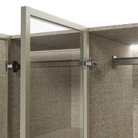 Beige wardrobe cabinet with glass doors, hanging rods, and top cabinets